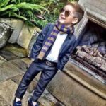 Kid pulling off the classic flip with this scarf