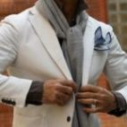 The Ascot Knot using a grey scarf on a white suit