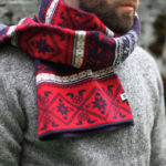 A red scarf in the classic flip A red scarf in the classic flip